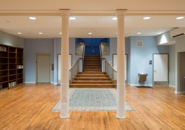 After: Multi-purpose Community Room with stairway to Congregation Space