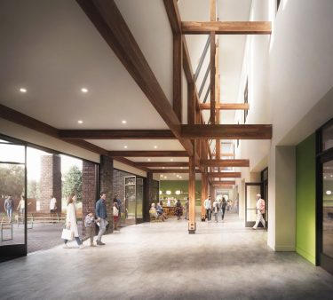 A two-story void with clerestory windows delivers an abundance of natural light along the main circulation corridor.